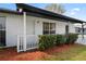 Charming exterior with front porch and well-maintained landscaping at 3141 Loomis Dr, New Port Richey, FL 34655