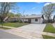 Traditional home with well-kept lawn and long concrete driveway at 3141 Loomis Dr, New Port Richey, FL 34655