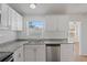 Well-lit kitchen showcasing stainless steel appliances, granite countertops and ample cabinet space at 3141 Loomis Dr, New Port Richey, FL 34655