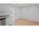 Bright eat-in kitchen with a view to adjacent space features granite countertops and stainless appliances at 3141 Loomis Dr, New Port Richey, FL 34655
