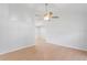 Bright living room featuring vaulted ceilings, a modern ceiling fan, and laminate flooring at 3141 Loomis Dr, New Port Richey, FL 34655