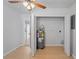 Utility room with wood-look floors, a closet, and hot water tank at 3141 Loomis Dr, New Port Richey, FL 34655