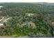 Overhead shot of the property surrounded by woods, highlighting its peaceful and private environment at 3355 La Vista St, Brooksville, FL 34604