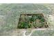Aerial view of a secluded home nestled among lush trees, providing privacy and a connection with nature at 3355 La Vista St, Brooksville, FL 34604