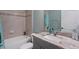 Bright bathroom with stylish fixtures, a shower-tub combo, and granite countertops at 3355 La Vista St, Brooksville, FL 34604