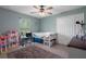Charming bedroom with closet, desk, fun decor, ceiling fan, and a comfortable bed at 3355 La Vista St, Brooksville, FL 34604