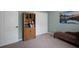 Cozy bedroom with a bookshelf, closet, contemporary decor, and comfortable furnishings at 3355 La Vista St, Brooksville, FL 34604