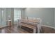 Charming dining area featuring a large window, bench seating and neutral color palette at 3355 La Vista St, Brooksville, FL 34604
