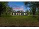 Inviting single-story home with well-maintained lawn and a covered front porch, perfect for relaxing outdoors at 3355 La Vista St, Brooksville, FL 34604