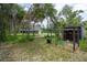 Charming single-story home with a spacious front yard and a rustic chicken coop at 3355 La Vista St, Brooksville, FL 34604