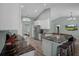 Contemporary kitchen featuring granite countertops, modern appliances, and adjacent breakfast bar at 3355 La Vista St, Brooksville, FL 34604