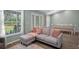 Open-concept living room with large windows, offering seamless flow and bright, natural light at 3355 La Vista St, Brooksville, FL 34604
