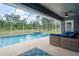 Enjoy the pool with a covered lanai, perfect for entertaining or relaxing poolside in comfort at 3355 La Vista St, Brooksville, FL 34604