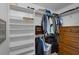 Walk-in closet with custom shelving and hanging racks offers ample storage for clothing and accessories at 3355 La Vista St, Brooksville, FL 34604