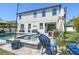 Inviting backyard featuring a pool with a spa, patio seating, and lush landscaping, perfect for relaxation and entertainment at 3555 Bracknell Ct, Land O Lakes, FL 34638