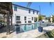 Beautiful backyard featuring a sparkling pool, gazebo, and ample seating, perfect for outdoor entertaining and relaxation at 3555 Bracknell Ct, Land O Lakes, FL 34638