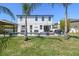 Stunning backyard featuring a sparkling pool, gazebo, and ample seating, perfect for outdoor entertaining and relaxation at 3555 Bracknell Ct, Land O Lakes, FL 34638