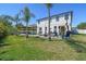 Beautiful backyard with a pool, gazebo, and lush landscaping, creating a private and serene outdoor oasis at 3555 Bracknell Ct, Land O Lakes, FL 34638