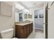 Bathroom features double sinks, a granite countertop, and neutral wall colors at 3555 Bracknell Ct, Land O Lakes, FL 34638