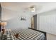 Cozy bedroom features a neutral color scheme, a queen bed, and an interior closet at 3555 Bracknell Ct, Land O Lakes, FL 34638