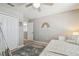 Bright bedroom with a daybed, built-in shelving, and view into hall at 3555 Bracknell Ct, Land O Lakes, FL 34638