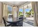 Dining room with view to the outdoor living space and lush backyard at 3555 Bracknell Ct, Land O Lakes, FL 34638