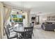 Indoor and outdoor living merges in this home with view to the back patio and living room at 3555 Bracknell Ct, Land O Lakes, FL 34638