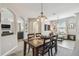 Inviting dining room with modern lighting, seamlessly connected to the living spaces at 3555 Bracknell Ct, Land O Lakes, FL 34638