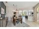 Open dining area with stylish lighting and views of the kitchen and living spaces at 3555 Bracknell Ct, Land O Lakes, FL 34638