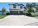 Stunning two-story home with a manicured lawn, a spacious driveway and a two-car garage at 3555 Bracknell Ct, Land O Lakes, FL 34638