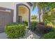 Inviting front entrance with a beautifully landscaped walkway and a charming front door at 3555 Bracknell Ct, Land O Lakes, FL 34638