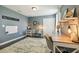 Bright home office with hardwood floors, dual desks, and a cozy rug at 3555 Bracknell Ct, Land O Lakes, FL 34638