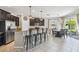 Bright kitchen with an island bar, stainless steel appliances, and an adjacent dining area at 3555 Bracknell Ct, Land O Lakes, FL 34638
