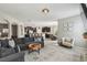 Large living room open to the kitchen and dining areas, neutral decor and plenty of space at 3555 Bracknell Ct, Land O Lakes, FL 34638