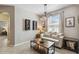 Cozy living room with natural light, display cabinets, neutral sofa, and stylish coffee table at 3555 Bracknell Ct, Land O Lakes, FL 34638