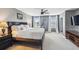 Bright main bedroom with large windows, plush carpet, and contemporary furnishings at 3555 Bracknell Ct, Land O Lakes, FL 34638