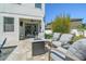 Cozy patio with comfortable seating and a fire pit, offering a relaxing outdoor space with views of the beautifully landscaped yard at 3555 Bracknell Ct, Land O Lakes, FL 34638