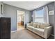 Bright sitting room with large window and a view of the adjacent bathroom at 3555 Bracknell Ct, Land O Lakes, FL 34638