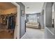 Sitting room with view of large closet, window and view of hallway archways at 3555 Bracknell Ct, Land O Lakes, FL 34638