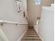 Bright, carpeted staircase leads to the upper level of the home with Gathering decor at 3555 Bracknell Ct, Land O Lakes, FL 34638