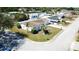 Aerial view of home showcasing the property's landscaping, roof, and neighborhood at 3752 Fox Dale Ln, Holiday, FL 34691