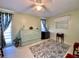 Bedroom with pull out bed, ceiling fan, and two windows at 3752 Fox Dale Ln, Holiday, FL 34691