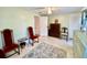 Bedroom featuring a ceiling fan, natural light, and chairs at 3752 Fox Dale Ln, Holiday, FL 34691