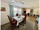 Bright dining area with a ceiling fan and views into the living room at 3752 Fox Dale Ln, Holiday, FL 34691