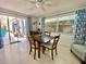 Dining room area with lots of natural light and a dining table at 3752 Fox Dale Ln, Holiday, FL 34691