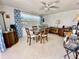 Dining room with a dark wood dining table and natural light at 3752 Fox Dale Ln, Holiday, FL 34691