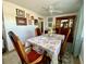 Dining room with lots of pictures on the wall and a beautiful display case at 3752 Fox Dale Ln, Holiday, FL 34691