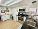 Bright kitchen with granite countertops, stainless appliances, ample storage, and a view of the backyard at 3752 Fox Dale Ln, Holiday, FL 34691