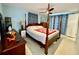 Main bedroom with furnishings and curtains at 3752 Fox Dale Ln, Holiday, FL 34691
