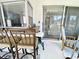 This home has a comfortable seating area on the patio, with a view of the sliding glass door at 3752 Fox Dale Ln, Holiday, FL 34691